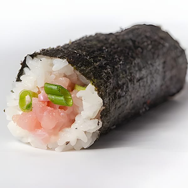 A close-up of a Poke Pub sushi roll with rice, pink fish, and green onions wrapped in nori.